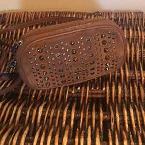 Coach w RIVETS used 2 zip clutch with strap .
